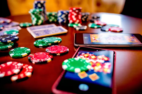 A glowing roulette wheel with cascading chips, symbolizing the engaging live and instant-win games available on 333OKK.